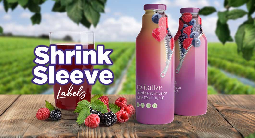 Two bottles of mixed berry juice with colorful shrink sleeve labels, a glass of juice, fresh berries, and a vineyard in the background. Text reads “Shrink Sleeve Labels.”.
