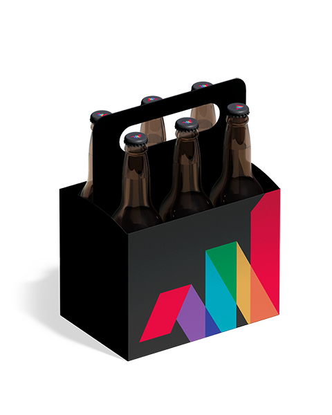 A six-pack of brown glass beer bottles in a black cardboard carrier featuring a colorful geometric design on the front.