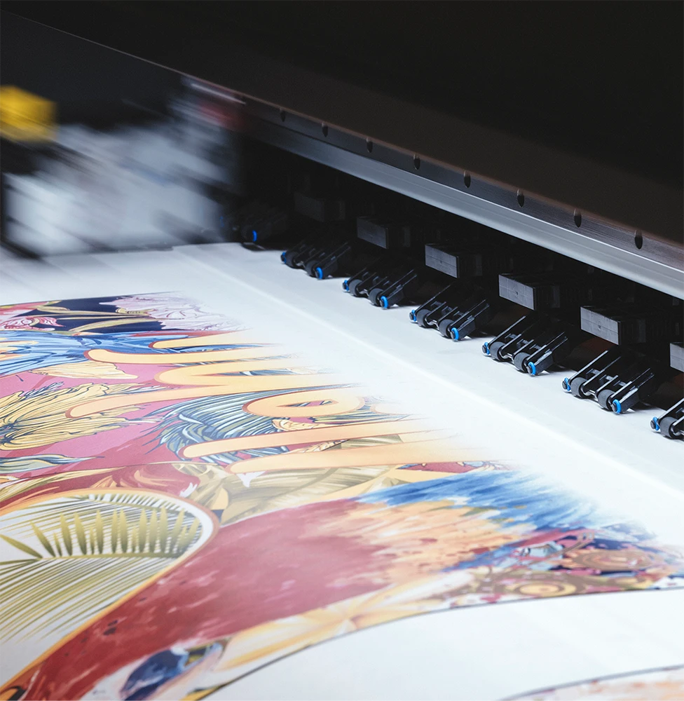 A large-format printer printing a colorful, detailed graphic design on paper.
