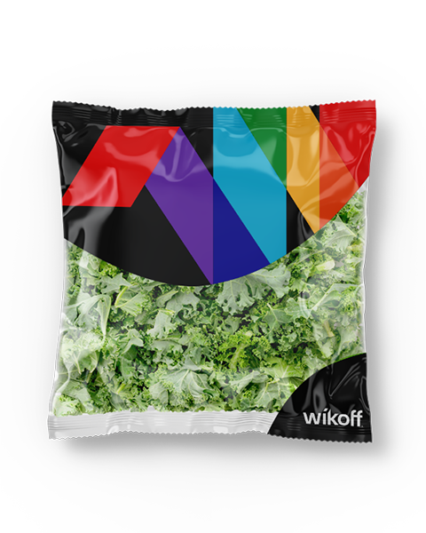 A sealed plastic bag filled with chopped leafy greens, featuring a colorful geometric design and the word "wikoff" on the packaging.