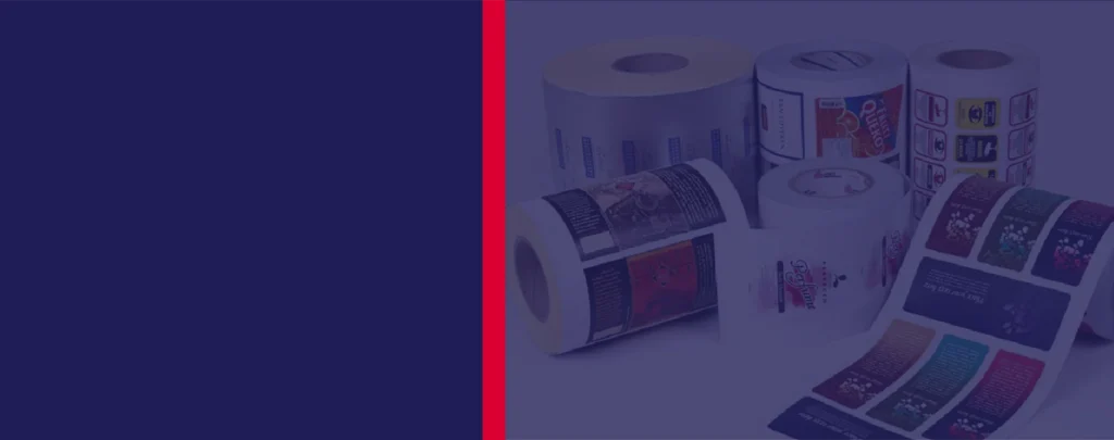 Several rolls of printed labels with various designs are displayed on a surface, with a plain dark blue and red background to the left.